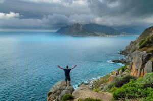 Chapmans Peak beautiful Ocean View with man. South Africa Photo Tours