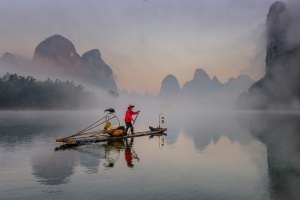 Guilin Cormorant Fisherman in the Mist. China Photo Tour