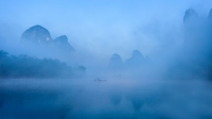 Fisherman in the Mist. China Photo Tour