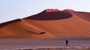 Photographer photographing Sossusvlei Dunes. Namibia photo tours