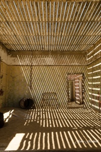 Kolmanskop Ghost Town room with contrasting light. Namibia photo tours